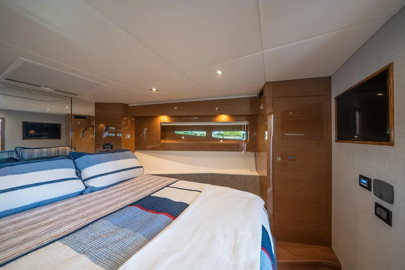 Slide: The Image of Luxurious 2019 Cruisers Yachts Cantius bedroom interior with modern design and cozy bedding. - 33