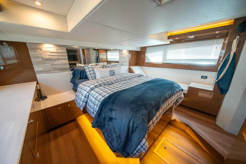Slide: The Image of Luxurious 2019 Cruisers Yachts Cantius bedroom with modern decor and ambient lighting. - 4