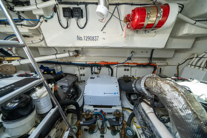 Slide: The Image of Engine room of 2019 Cruisers Yachts Cantius, featuring Seakeeper 6 and fire safety equipment. - 51