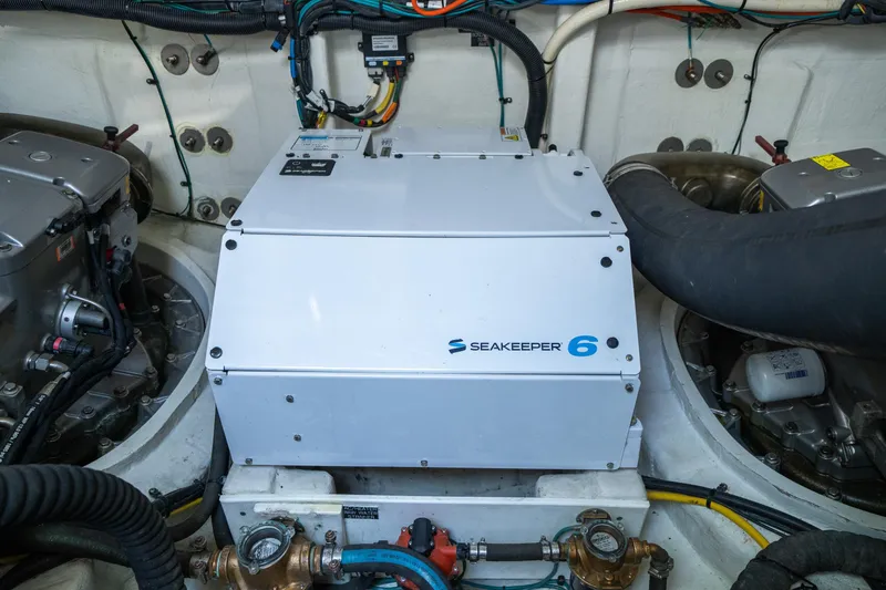 Slide: The Image of Engine room of 2019 Cruisers Yachts Cantius featuring Seakeeper 6 stabilizer system. - 52