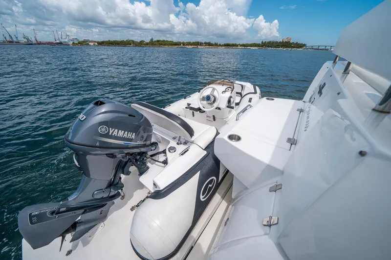 Slide: The Image of 2019 Cruisers Yachts Cantius with Yamaha engine on open water, clear sky background. - 7