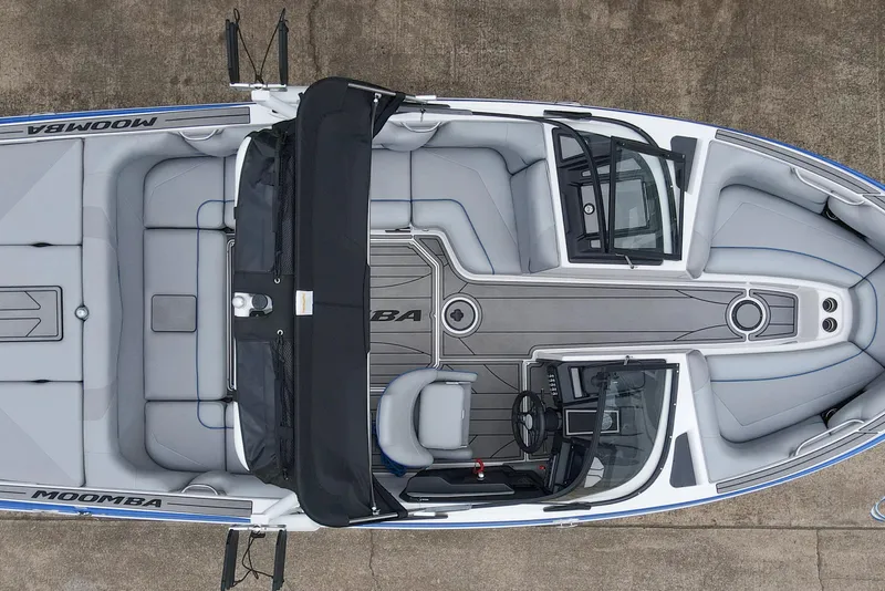 Slide: The Image of 2021 Moomba Craz boat interior, top view, showcasing seating and steering layout. - 26