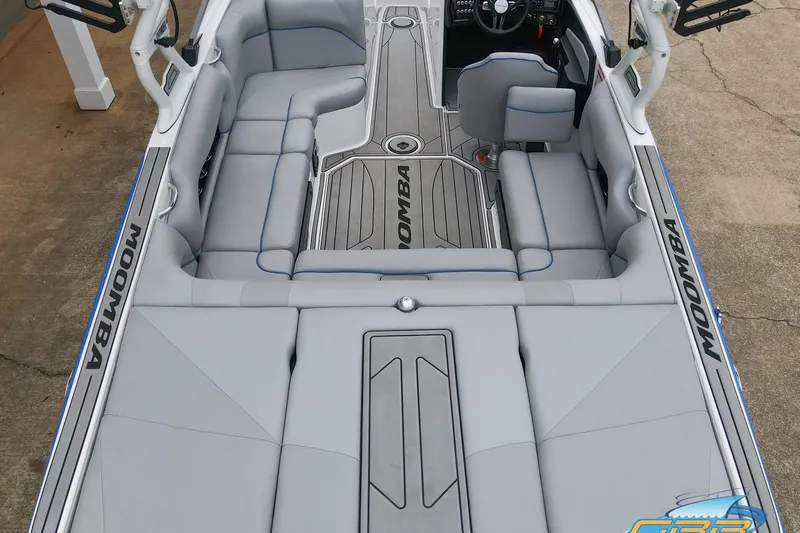 Slide: The Image of 2021 Moomba Craz boat interior with gray seating and sleek design. - 28