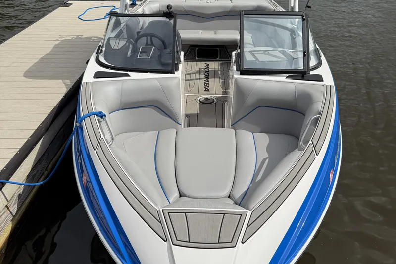 Slide: The Image of 2021 Moomba Craz boat docked, featuring sleek design and comfortable seating. - 5