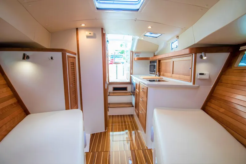 Slide: The Image of Interior of 2023 MJM 35 yacht with wooden accents and modern amenities. - 25