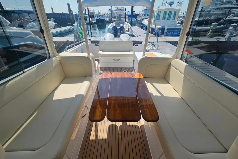 Slide: The Image of Luxurious 2023 MJM 35 yacht interior with elegant seating and polished wooden table. - 34
