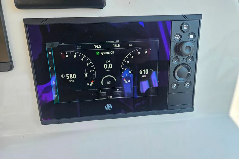 Slide: The Image of Digital dashboard display on 2023 MJM 35 boat showing RPM and system status. - 37