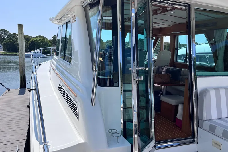 Slide: The Image of Luxurious interior of 2022 Sabre 48 Salon Express yacht with plush seating and wooden finishes. - 12