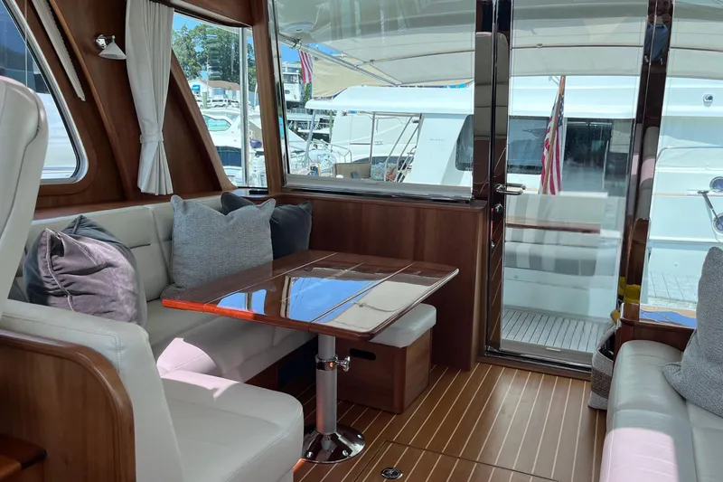 Slide: The Image of Interior of 2022 Sabre 48 Salon Express yacht with wooden cabinetry and modern kitchen. - 18