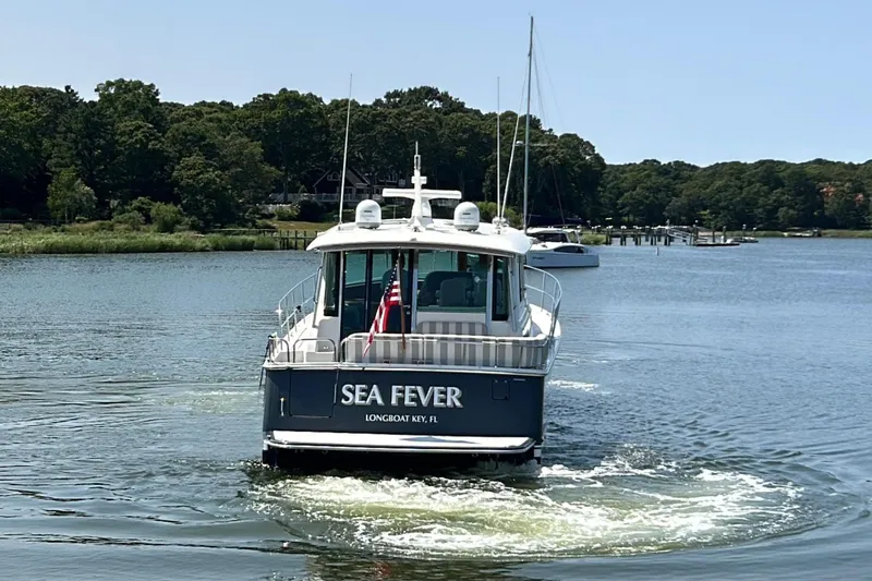 Slide: The Image of Aerial view of 2022 Sabre 48 Salon Express yacht on calm water. - 2