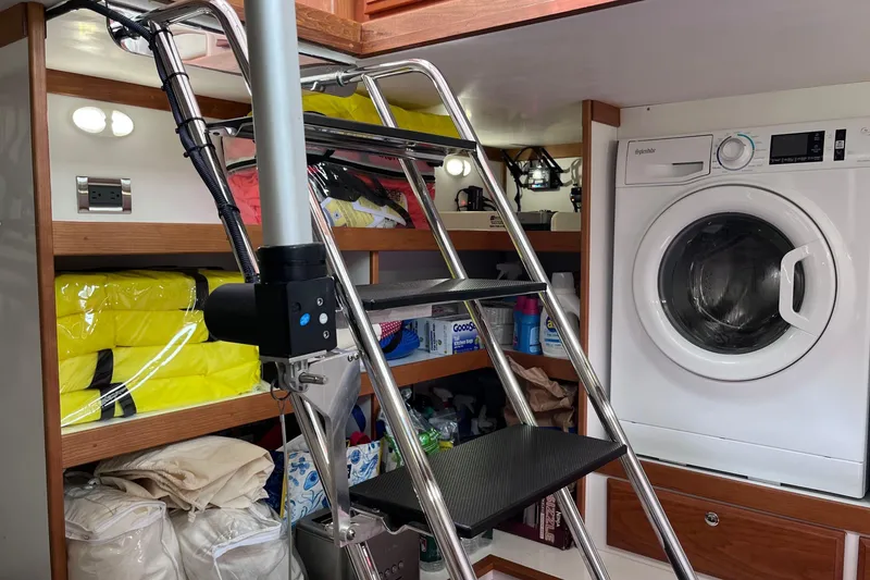 Slide: The Image of Luxurious 2022 Sabre 48 Salon Express cabin with elegant wood finish and cozy bedding. - 22