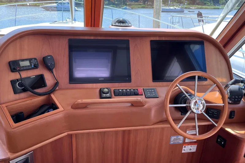 Slide: The Image of Luxurious 2022 Sabre 48 Salon Express interior with elegant wood finishes and modern amenities. - 28