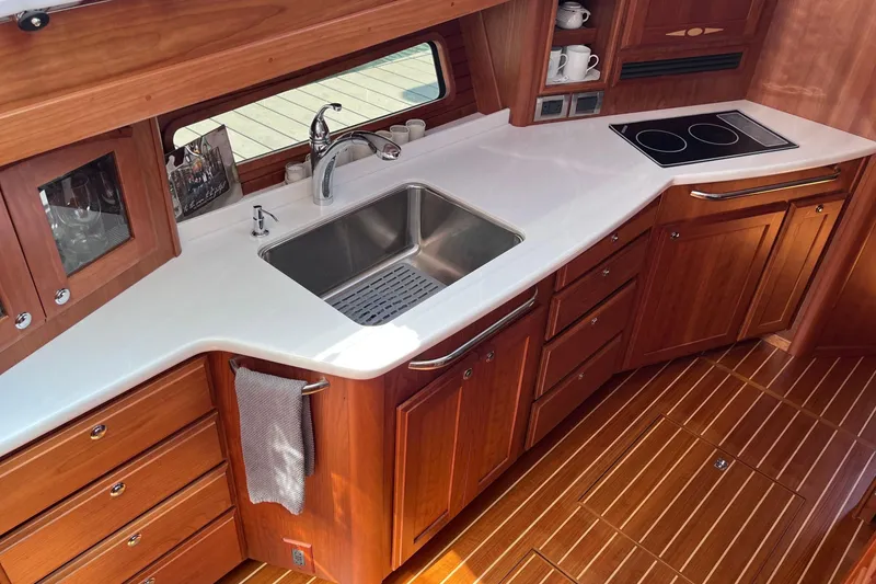 Slide: The Image of Luxurious cabin interior of 2022 Sabre 48 Salon Express yacht with cozy bedding. - 30