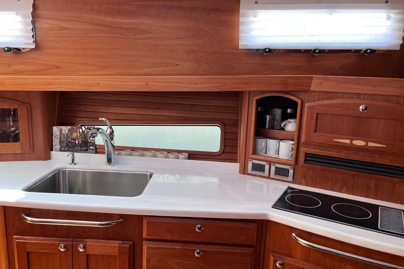 Slide: The Image of Luxurious wooden interior of 2022 Sabre 48 Salon Express yacht cabin. - 32