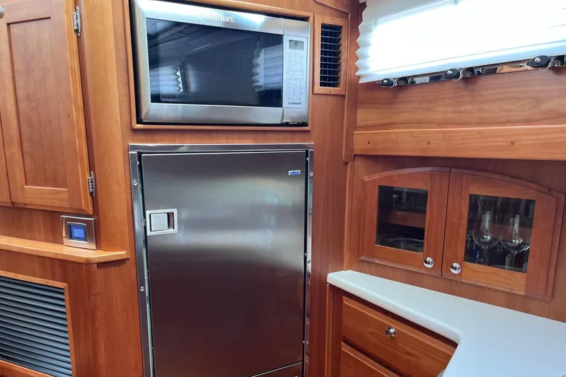 Slide: The Image of Luxurious bathroom in 2022 Sabre 48 Salon Express yacht with modern fixtures and wood accents. - 34