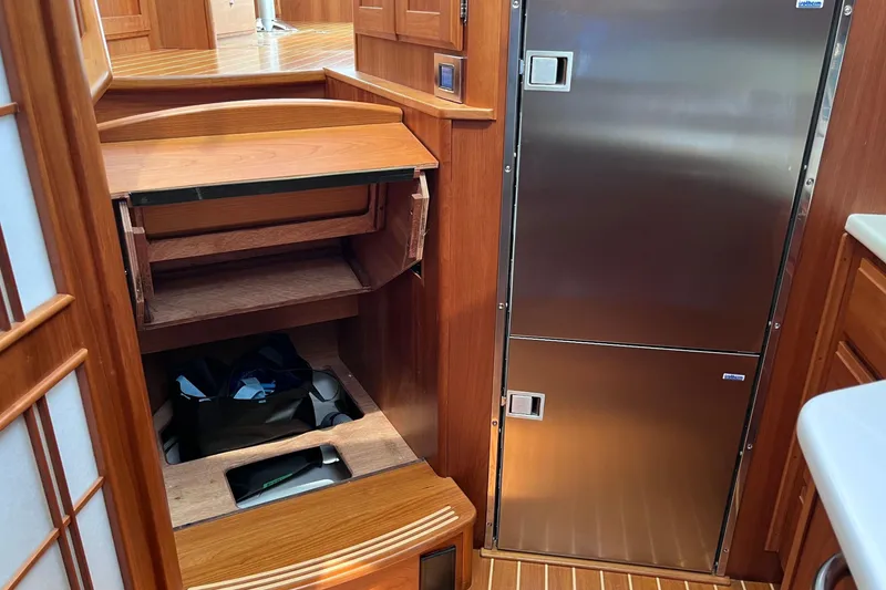 Slide: The Image of Luxurious bathroom interior of 2022 Sabre 48 Salon Express yacht, featuring wood accents and modern fixtures. - 35