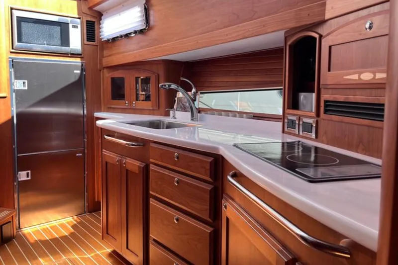 Slide: The Image of Interior of 2022 Sabre 48 Salon Express yacht with luxurious seating and scenic views. - 39