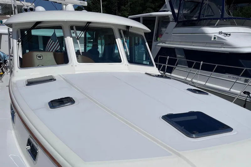 Slide: The Image of Bow view from 2022 Sabre 48 Salon Express yacht cruising on a sunny day. - 47