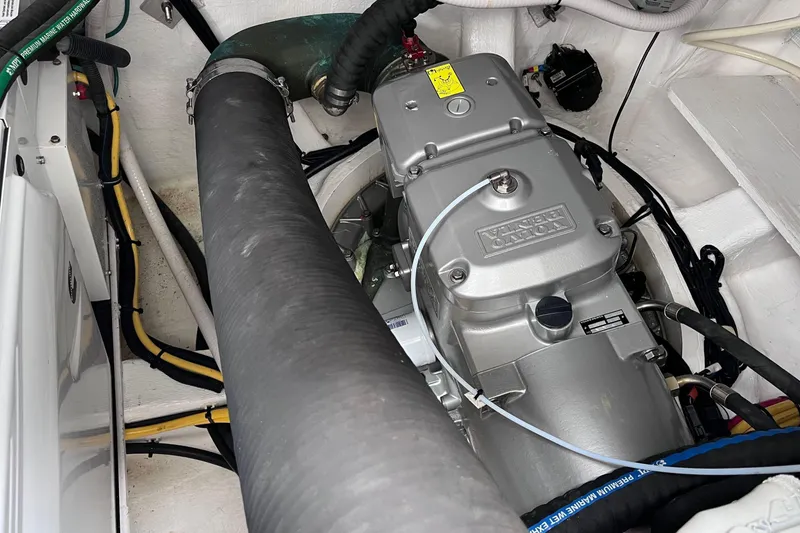 Slide: The Image of 2022 Sabre 48 Salon Express cruising on open water under a clear sky. - 55