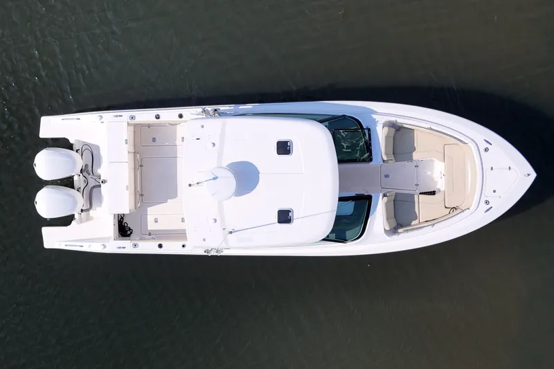 Slide: The Image of Top view of 2018 Pursuit DC 295 Dual Console boat on water. - 10
