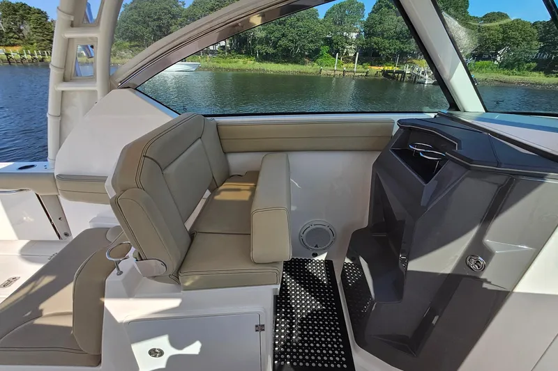 Slide: The Image of 2018 Pursuit DC 295 Dual Console interior with seating and water view. - 34