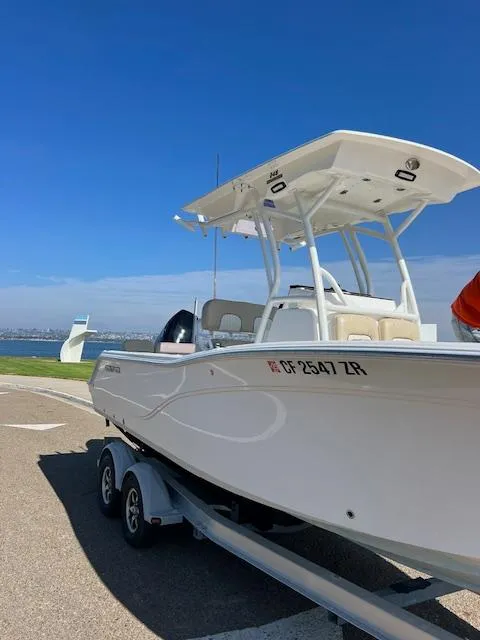 Slide: The Image of 2018 Sea Fox 248 Commander boat on trailer under clear blue sky. - 20