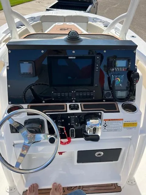 Slide: The Image of 2018 Sea Fox 248 Commander boat dashboard with steering wheel and navigation controls. - 29