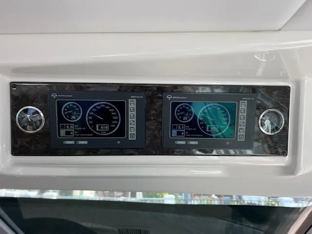 Slide: The Image of Control panel of a 2008 Sea Ray 55 Sundancer yacht, featuring dual display screens. - 5