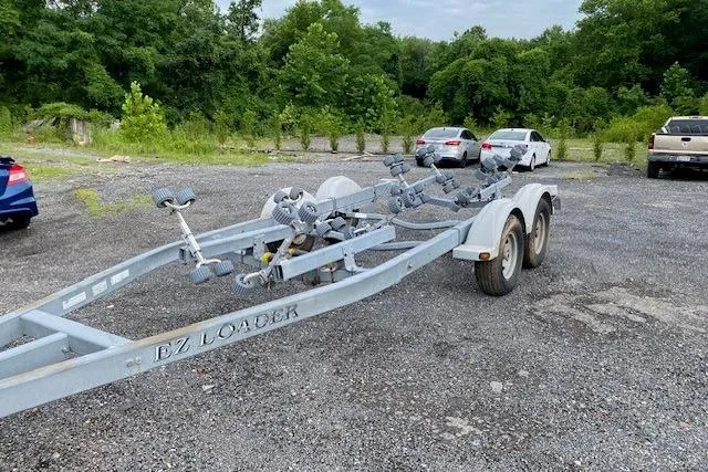 Slide: The Image of Trailer for 2008 Parker 2310 Walkaround boat in a parking lot. - 20