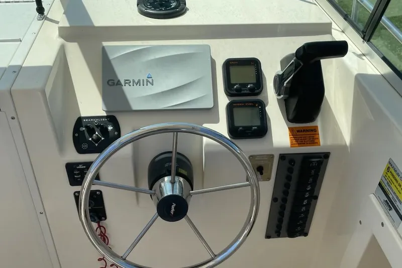 Slide: The Image of Steering console of 2008 Parker 2310 Walkaround boat with Garmin navigation system. - 4