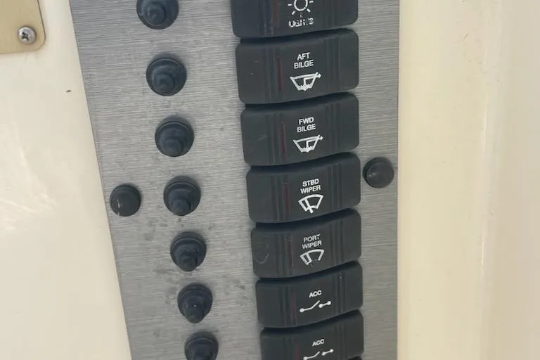 Slide: The Image of Control panel with labeled switches on a 2008 Parker 2310 Walkaround boat. - 8