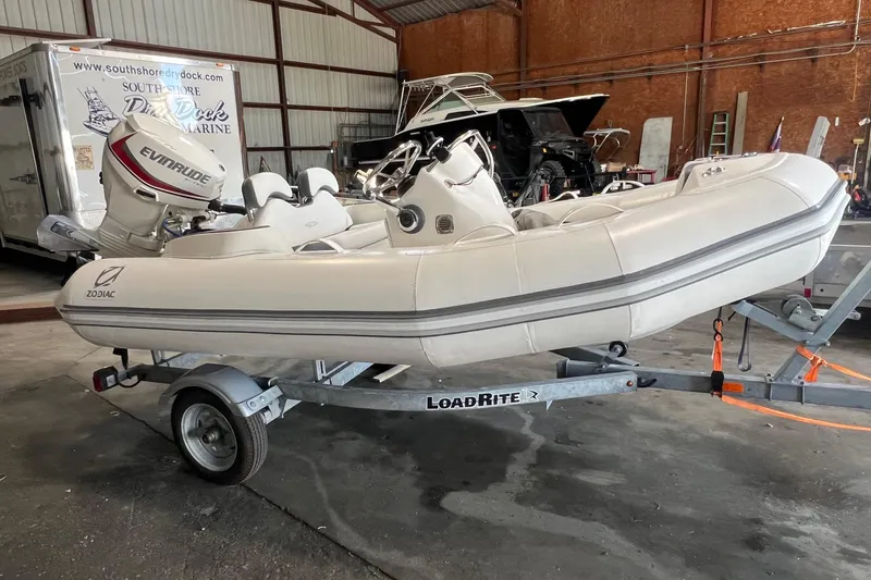 Slide: The Image of 2021 Zodiac Yachtline 360 inflatable boat on trailer in a storage facility. - 7