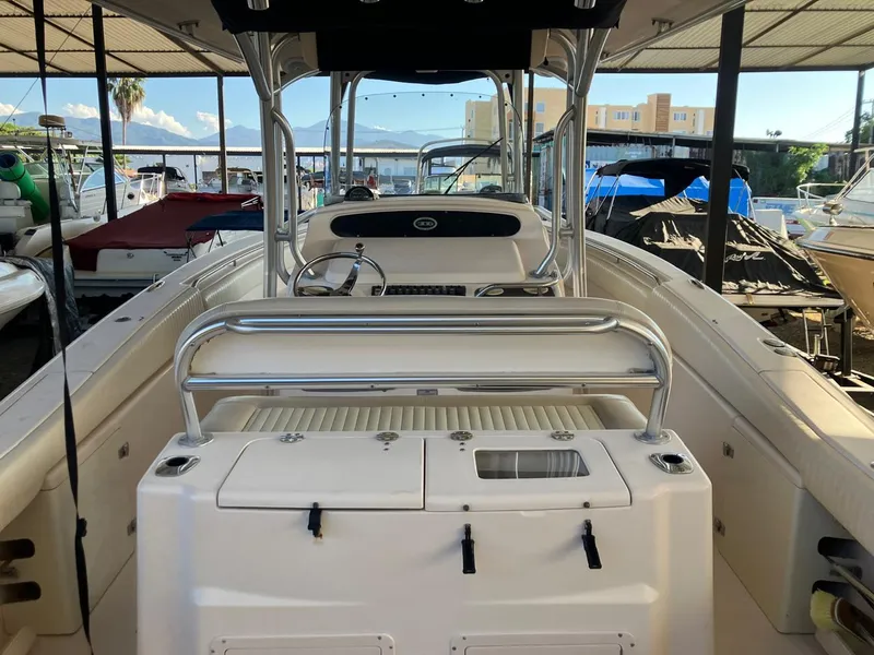 Slide: The Image of 2006 Grady-White Bimini 306 boat interior with helm and seating area. - 10