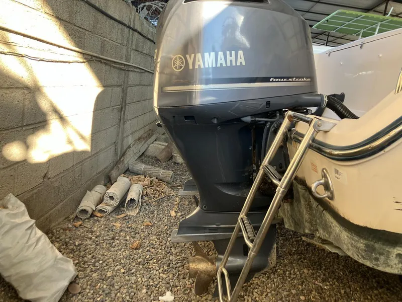 Slide: The Image of 2006 Grady-White Bimini 306 with Yamaha outboard motor in storage. - 12