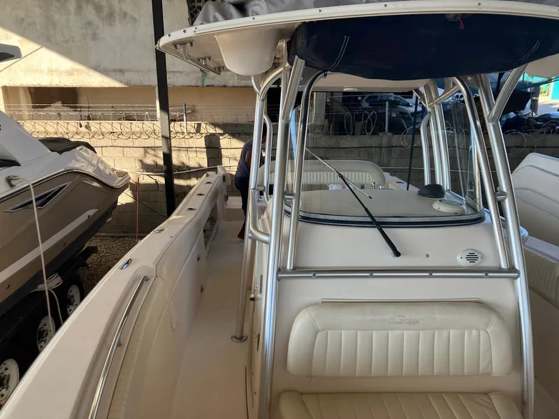 Slide: The Image of 2006 Grady-White Bimini 306 boat interior with seating and windshield. - 20