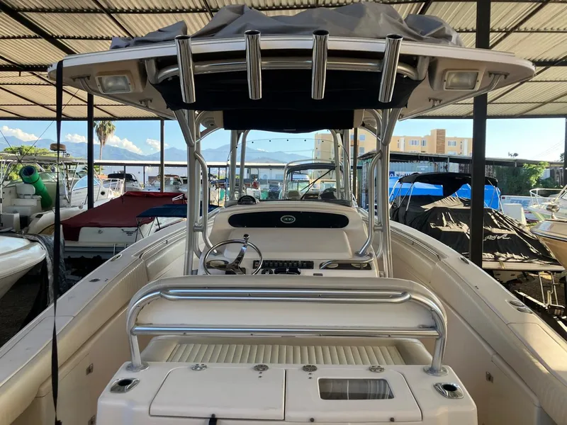 Slide: The Image of 2006 Grady-White Bimini 306 boat in covered marina, front view. - 27