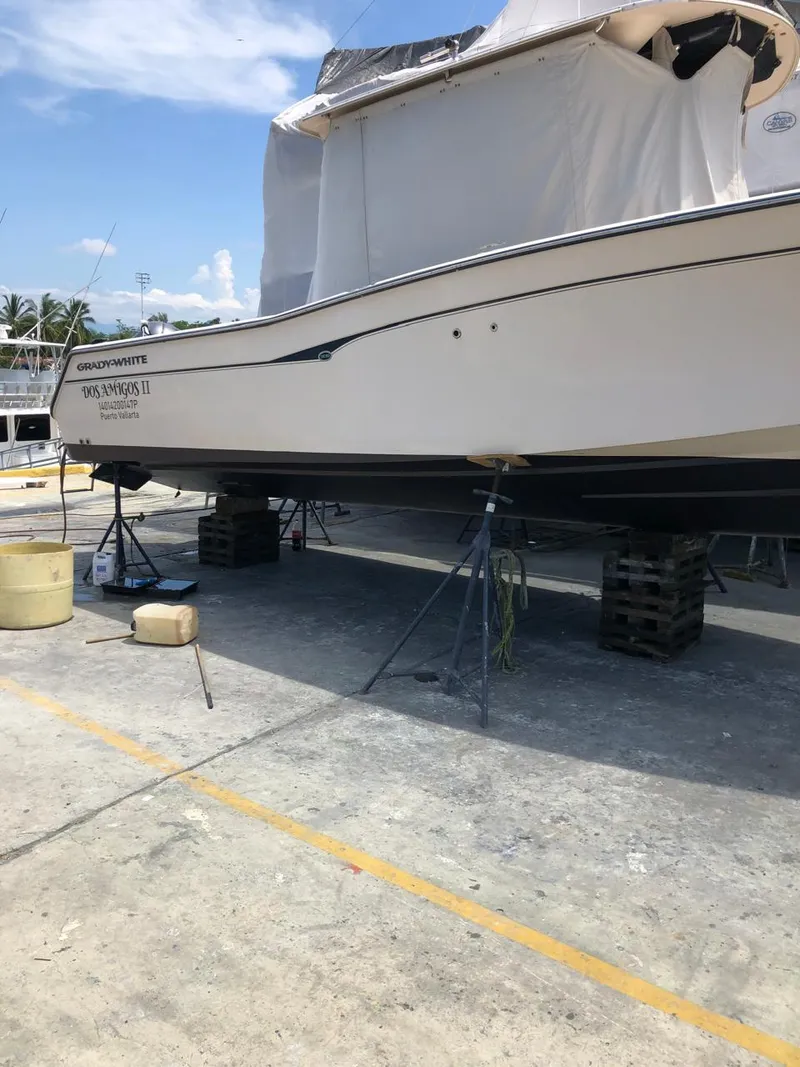 Slide: The Image of 2006 Grady-White Bimini 306 boat on dry dock for maintenance. - 3