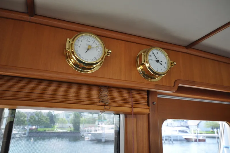 Slide: The Image of Interior of 2015 Helmsman Trawlers 31 Sedan with brass clock and barometer. - 29