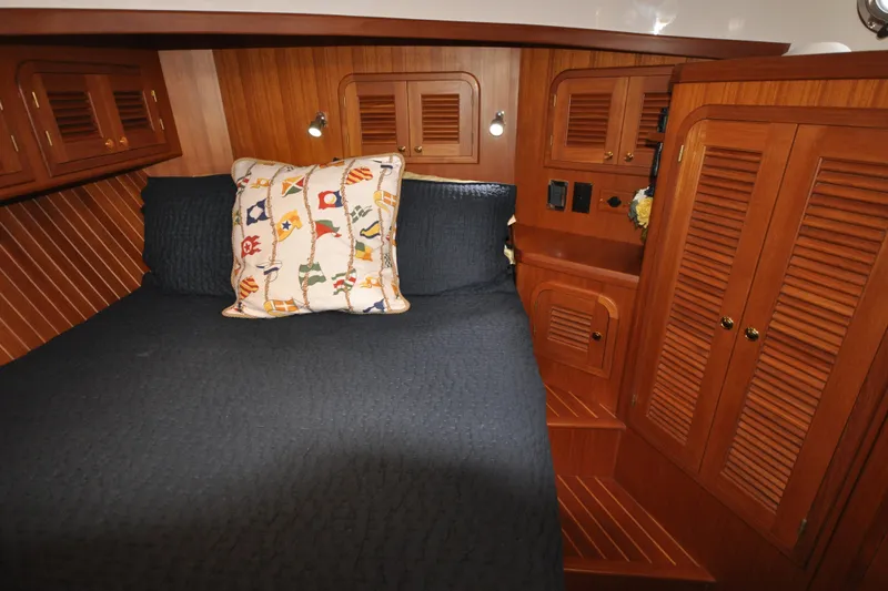 Slide: The Image of Cozy cabin interior of 2015 Helmsman Trawlers 31 Sedan with wooden cabinetry. - 34