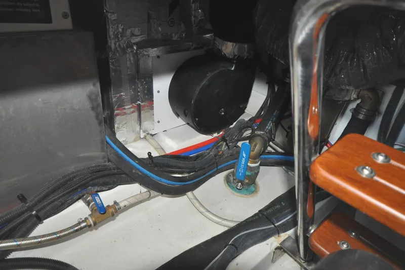 Slide: The Image of Engine room of 2015 Helmsman Trawlers 31 Sedan with visible wiring and components. - 42