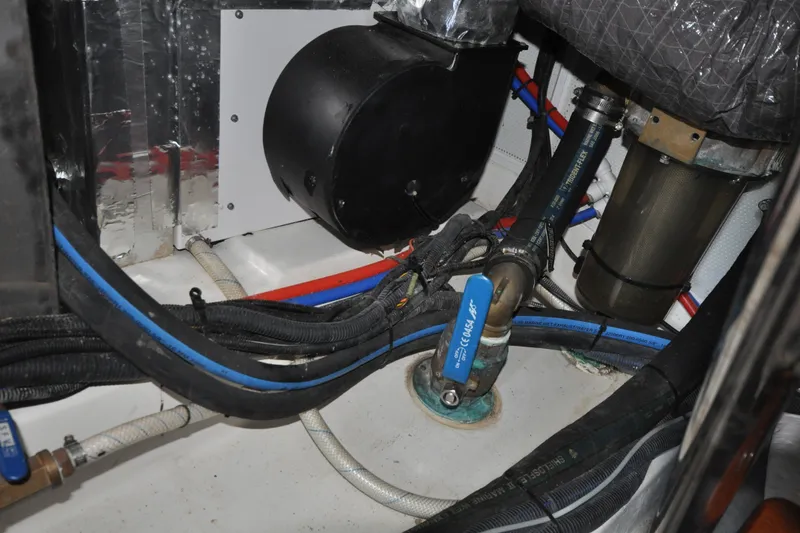 Slide: The Image of Engine room of 2015 Helmsman Trawlers 31 Sedan with visible hoses and components. - 43