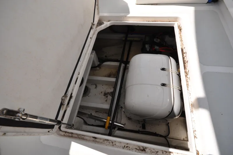 Slide: The Image of Open hatch of 2015 Helmsman Trawlers 31 Sedan, revealing interior storage compartment. - 48
