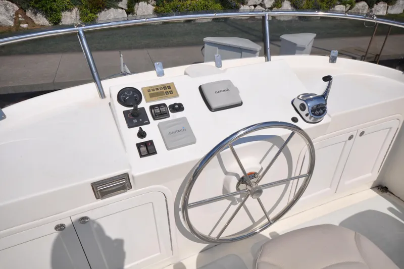 Slide: The Image of Helmsman Trawlers 31 Sedan 2015 helm with Garmin navigation and control panel. - 53