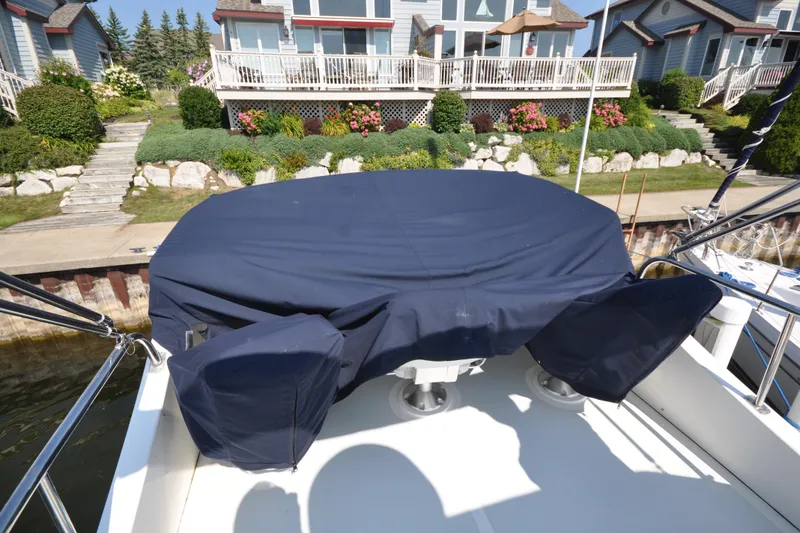 Slide: The Image of Helmsman Trawlers 31 Sedan 2015 boat deck with covered seating area. - 61