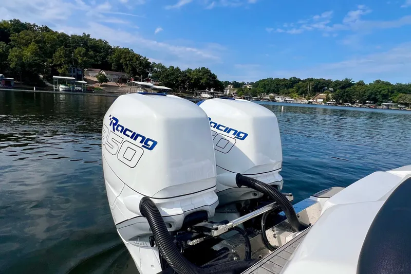 Slide: The Image of 2020 Nor-Tech 340 Sport Center Console with twin 350 Racing engines on a lake. - 12