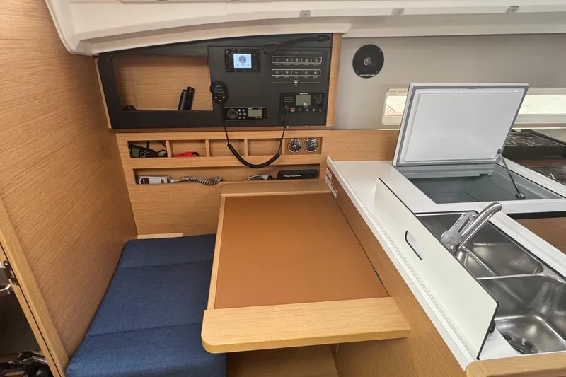 Slide: The Image of Interior of 2020 Jeanneau Sun Odyssey 410 yacht with navigation station and galley. - 11