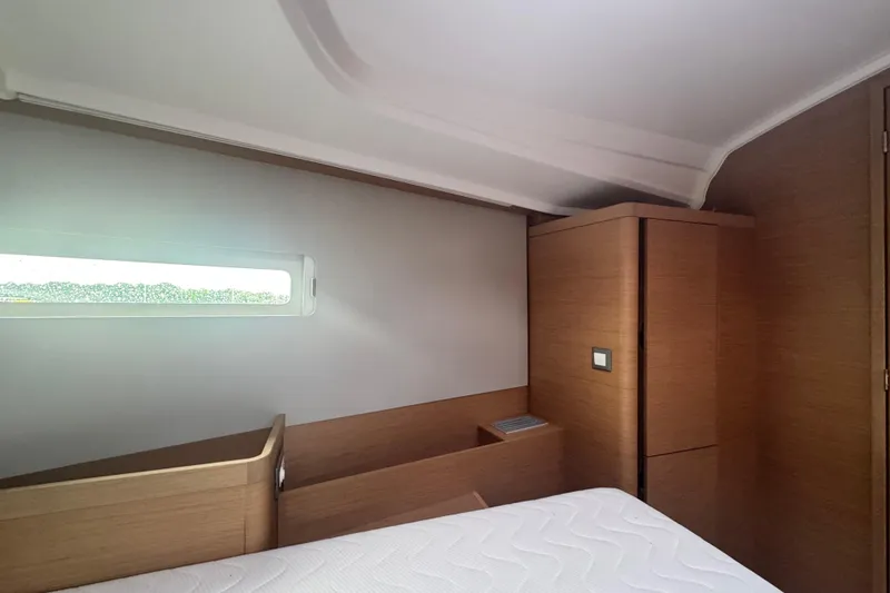Slide: The Image of Interior cabin of 2020 Jeanneau Sun Odyssey 410 yacht, featuring modern wood finish. - 17