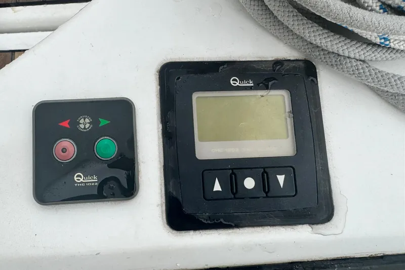 Slide: The Image of Control panel on Jeanneau Sun Odyssey 410 yacht, featuring Quick THC1022 thruster controls. - 30
