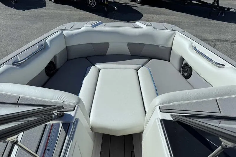 Slide: The Image of 2021 Moomba Max boat interior with cushioned seating and sleek design. - 9