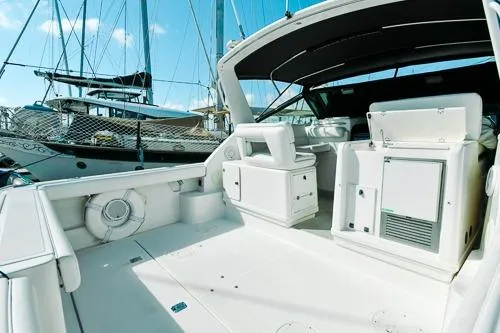 Slide: The Image of 2001 Tiara Yachts 3100 Open, spacious deck, marina view, luxury boating experience. - 1